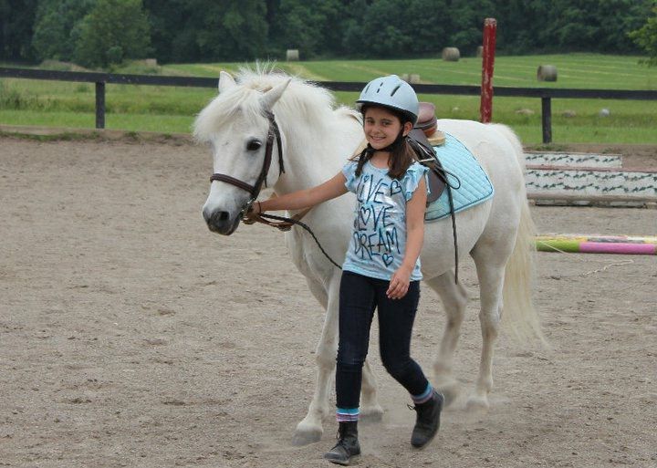 Young Chloe with her first pony — where it all began